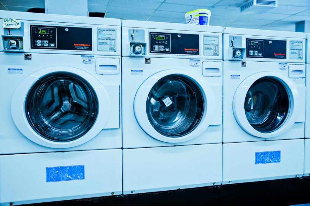Contemporary laundromat with automated washing machines. Ideal for laundry and cleaning services.